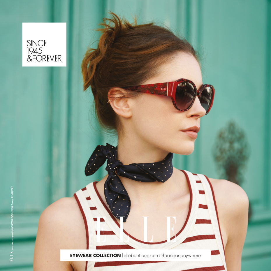 Elle: Junge Frau mit schwarzer Brille